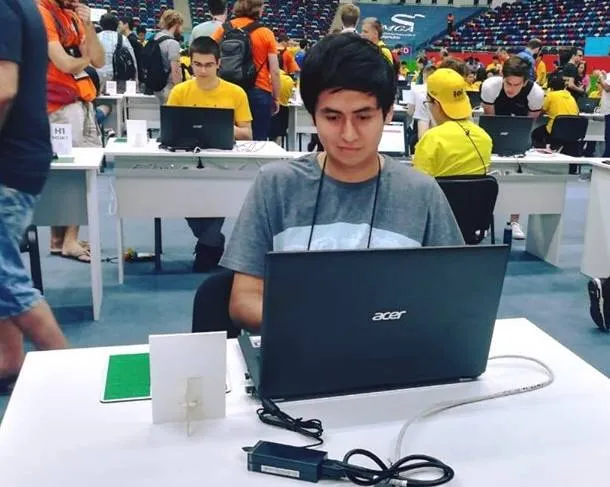 Mauricio competing for Chile at IOI 2019 in Baku